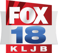 A logo for Fox affiliate KLJB, one of many examples of a Fox station still using searchlights in their logo.