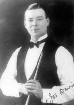 Joe Davis dressed in a waistcoat and bow tie, holding a billiard cue
