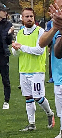 Alessandro Riggi wearing a pinny on the pitch