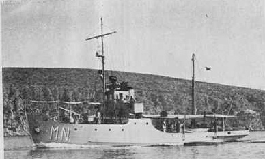 a photograph of a small ship underway