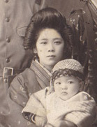 Kane Tanaka holding her younger brother Nobuo Tanaka in the 1920's