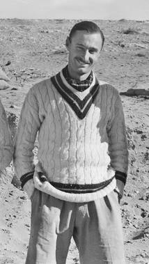 Informal portrait of Gordon Steege in cricket blazer with hands in pockets