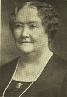 Portrait photograph of middle-aged woman.
