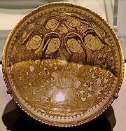 Bowl with Seated Figures by a Pond, Iran 1211-12, by Abu Zaid, Ashmolean Museum.[7]
