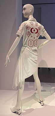 Dress in white fabric styled to resemble a sports jersey