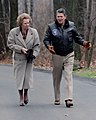 Prime Minister Margaret Thatcher and President Ronald Reagan in discussion during a walk at Camp David, 1986
