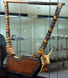a stringed instrument with a bovine head