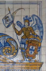 "Lieutenant Archangel holding the arms of Portugal" in a tile panel in the National Azulejo Museum