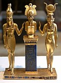 Osiris on a lapis lazuli pillar in the middle, flanked by Horus on the left, and Isis on the right; 875–850 BC; gold and lapis lazuli; 9 cm; Louvre