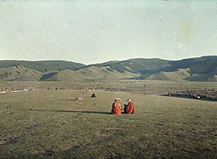 1913 photo of monks on Tasgan Hill facing the city to the south.