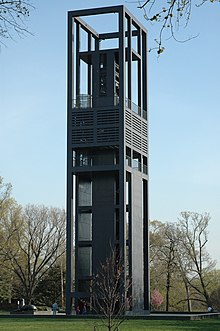 A rectangular tower made of steel beams and panels