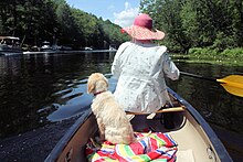 A woman canoeing on the Schroon River.