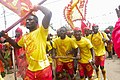 A group of men dancing and chanting during the Aboakyer festival in Ghana