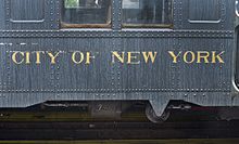 The side of an R1–9 fleet car, an original IND subway car purchased by the BOT, bearing the name "City of New York".