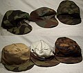 3 Camouflaged M41 field caps in Heer splinter, Italian, and SS blurred edge. Note sweatband on fall side of SS field cap.