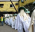 Masquerades of the Eyo Iga Sasi entering the TBS in Lagos in procession.