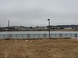 Fish Trap Lake Park in West Dallas, including the smokestack of the defunct RSR Corporation smelter in the background