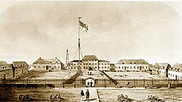 A drawing of a courtyard. A flag is supported by a large pole in the middle.