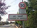 Village sign on the approach to Le Sart