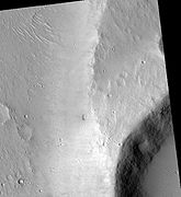 Maja Valles streamlined island, as seen by HiRISE. Island formed behind the impact crater at the lower right.