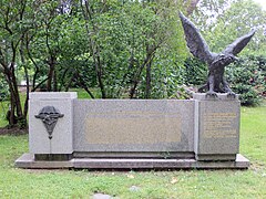 Low stone monument, with an eagle on the top right