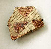 Fragment of pottery with incised and painted decor. From Tell Hassuna, 6500 - 6000 BC.