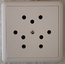 Type 12 triple socket (10 A), now obsolete and no longer sold or installed