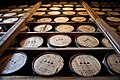 Barrels of Woodford Reserve bourbon aging in a rickhouse.