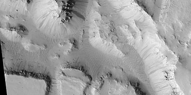 Layered mesas, as seen by HiRISE under HiWish program. Dark slope streaks are also visible.