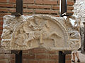 A fragment of a decorated frieze at Felix Romuliana, a palace built by the emperor Galerius in modern-day Serbia. The fragment depicts a rider wielding an ax, and a shield-bearing soldier on foot.