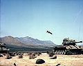 M712 Copperhead, a laser guided artillery shell, approaches a target tank