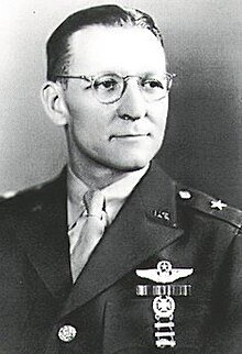 Head and shoulders view of man in military uniform with decorations