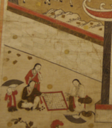 "Giảng học đồ" (Teaching), 18th century, Hanoi museum of National History. Scholars and students wear áo giao lĩnh (cross-collared gowns) - unlike the buttoned áo dài.