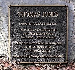 Plaque that reads "THOMAS JONES. Labourer, Late of Sarsfield. Died after a fall from the Mitchell River Bridge 26.12.1893 – Aged 73 Years. Transported to Australia in 1840 for breaching security at Windsor Castle. Plaque erected by East Gipps Historical Society 2005"