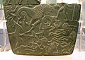 Image 24Possible prisoners and wounded men of the Buto-Maadi culture devoured by animals, while one is led by a man in long dress, probably an Egyptian official (fragment, top right corner). Battlefield Palette. (from Prehistoric Egypt)