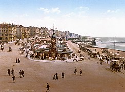 A photochrom of Brighton Aquarium with the pier in the background, originally photographed around 1890