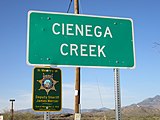Signs at the Ciénega Creek Natural Preserve, including a memorial for Jimmie Mercer, who was ambushed by a cattle rustler near Pantano in 1914