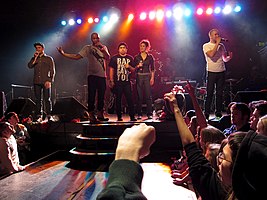 Doomtree performing at First Avenue in 2010 (left to right: Cecil Otter, P.O.S, Mike Mictlan, Dessa, and Sims)