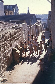 Children playing in the streets of Nachlaot during the 1948 siege of Jerusalem