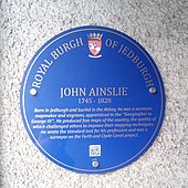 Blue plaque in Jedburgh commemorating John Ainslie, surveyor and cartographer
