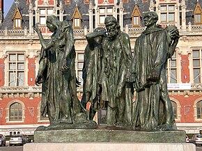 Six life-size bronze statues of men wearing robes and expressions of distress