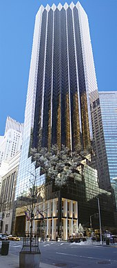 a view upward toward the top of the Trump Tower, a 68-story building with a brown-glassed facade