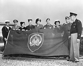 Eisenhower, who served as Supreme Allied Commander Europe, depicted on 8 October 1951 in front of the flag of NATO's Supreme Headquarters Allied Powers Europe (SHAPE). WUDO's plans, structures and responsibility of defending Western Europe were transferred to SHAPE.