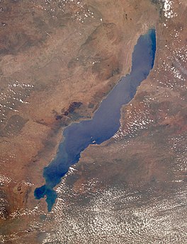 Satellite image of lake with clouds in forground.