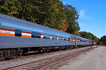 A passenger train is seen, primarily its stainless steel coaches, which have the name "PROVIDENCE & WORCESTER" on their sides, and are named after the states P&W serves, including Connecticut, Rhode Island, and Massachusetts.