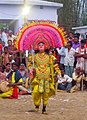 A chhau dancer performing among the villagers in Jharkhand