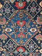 Section (central medallion) of a South Persian rug, probably Qashqai, late 19th century, showing irregular blue colours (abrash)