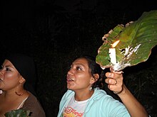 Cacaopera woman holding a candle in Morazan, El Salvador