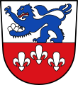 Gemeinde Edenbergen Geteilt von Silber und Rot, oben ein schreitender rot bewehrter blauer Löwe, der eine silberne Lilie in der linken Vorderpranke trägt; unten drei, eins zu zwei gestellte, silberne Lilien.