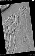 Well-developed hollows, as seen by HiRISE under the HiWish program. Hollows are on floor of a crater with concentric crater fill. The hollows develop because of movements of ice-rich sediment. There may be hundreds of metres of ice covered by a thin layer of sediments. Location is Casius quadrangle.